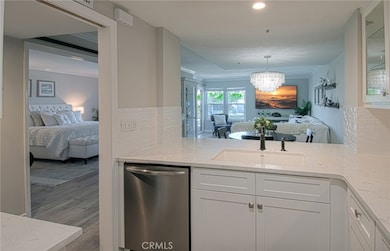 Kitchen looking into primary bedroom and living area.