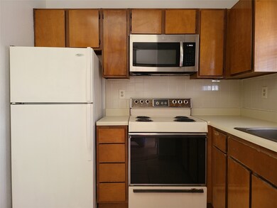 tiled kitchen w/fridge, extended window for garden