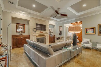 Den has custom built-ins and custom cast stone fir