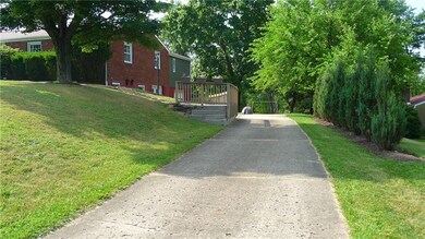 Long concrete driveway to the home provides ample 