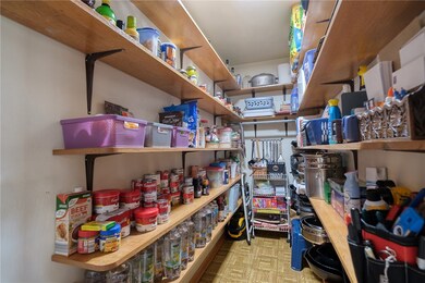 A chef's dream pantry is situated between the kitc