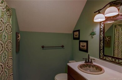 Upstairs full bath in hallway with shower/tub.