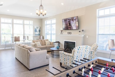 Green Wood Community Room with seating area, kitchenette, and foosball table