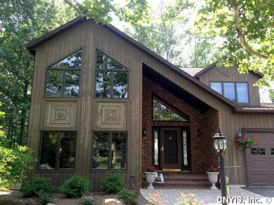 Exterior Front. Paver walkway, brick walled covere