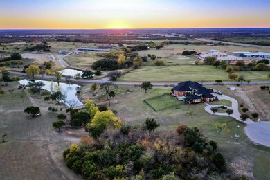 7.7 Acre Aerial view of property. The road is west boundary, north boundary is to the right of the driveway,  east boundary runs parallel to the west boundary at the edge of the tree clearing up to the cul-de-sac and the south boundary is a fence row