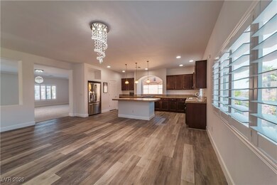 Kitchen with stainless steel refrigerator with ice