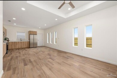 Kitchen featuring light brown cabinetry, modern cabinets, visible vents, and stainless steel appliances