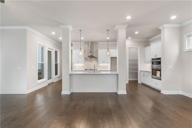 The well designed kitchen overlooks the family room and dining area.