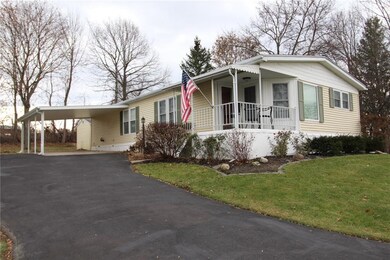 Large double wide blacktop driveway AND an attache
