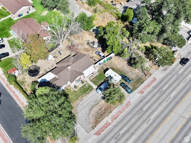 Aerial view of property's location with nearby suburban area
