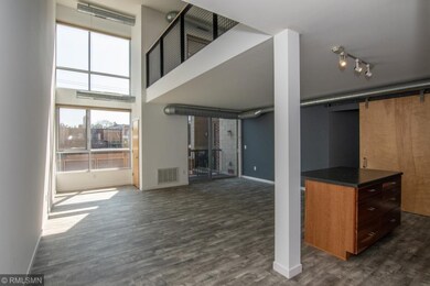 Large open concept with 2 story windows bringing i