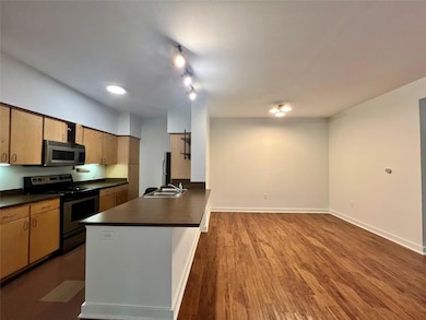 Kitchen featuring stainless steel appliances, dar