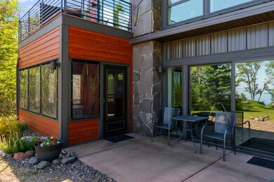 Entrance to property featuring a patio and a balco