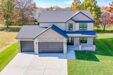 Craftsman-style house featuring roof with shingles, a front lawn, an attached garage, and a porch