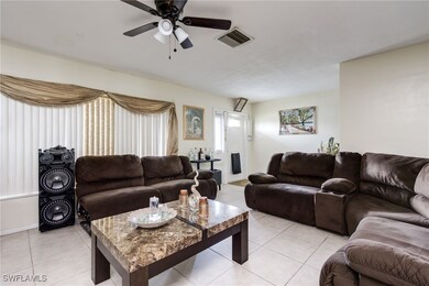 Living area featuring light tile patterned floors
