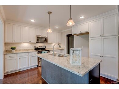 Beautifully updated kitchen featuring island, gran
