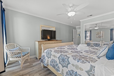 Bedroom featuring light hardwood / wood-style floo