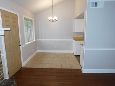 Unfurnished dining area with vaulted ceiling, a c