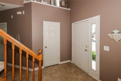 2 story entry. Front door with side lights. 
