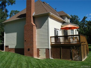 Right side view of home with brick chimney and upd