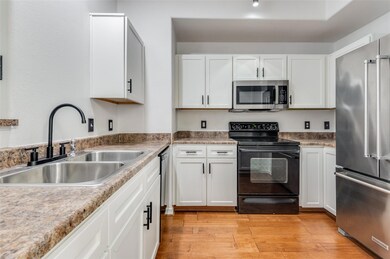 Kitchen with appliances with stainless steel finis