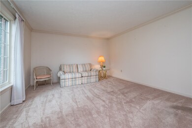 Sitting room inside the front door on the left.