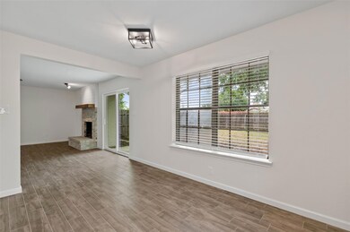 Unfurnished living room featuring hardwood / wood-
