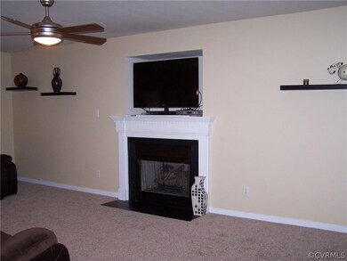 Family room with new carpet, fresh paint and cozy