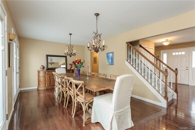 Gleaming hardwoods carry through to the formal hug