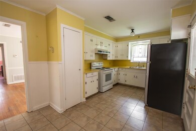 Kitchen with stainless steel fridge, dishwasher,  