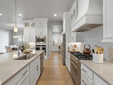 Quartz countertops, custom hood and range