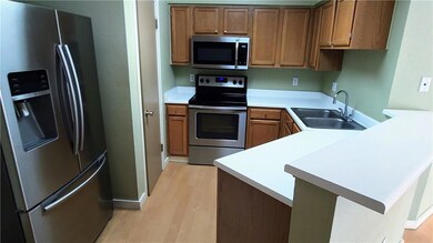 Kitchen featuring appliances with stainless steel