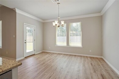 Dining area with French door to covered rear patio