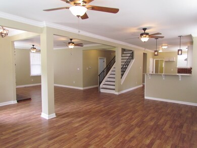 This view shows the kitchen side of the open floor
