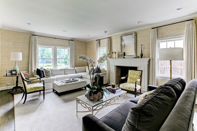 Oversized windows in the formal living expose the wonderful street and manicured landscaping in the front yard. Ample natural light streams from all angles and fills the room with light. The ambiance is complete with a handsome wood burning & gas-log fireplace keeping the space cozy and inviting.