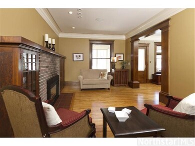 Living room with fireplace flanked by bookshelves