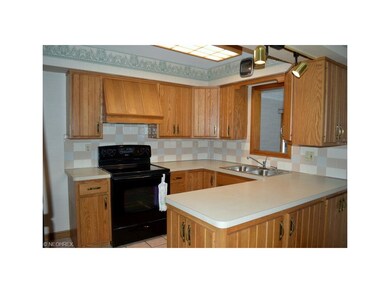 Kitchen features ceramic tile floor