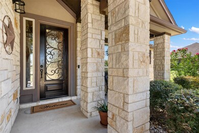 Property entrance featuring stone siding