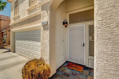 Front door with slate tile pattern walkway.