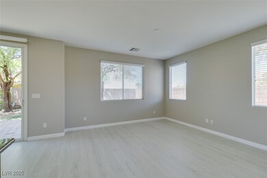 Empty room featuring light wood-style flooring, pl
