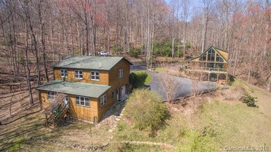 14+acres with main home and second  structure offe