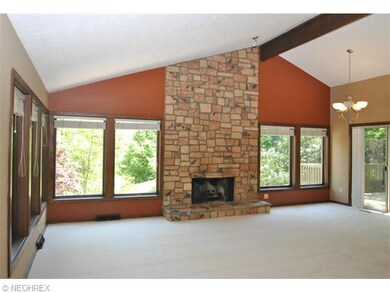 Great room has cathedral ceiling, windows everywhe