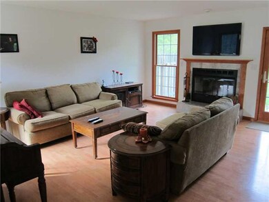 Living Room. Living Room features a wood burning f
