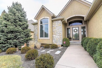 Upgraded landscaping and an inviting porch await y