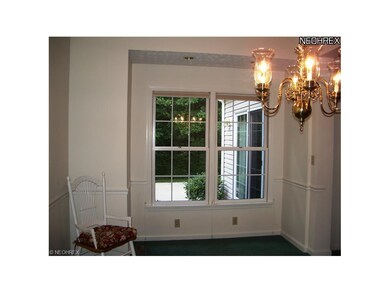 Vaulted formal Dining Room with chair rail and vie