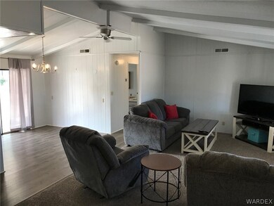 Living Room with Vaulted Ceiling and open Casual D