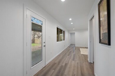 Hallway featuring wood finished floors and recess