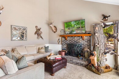 Carpeted living room featuring ornamental molding 