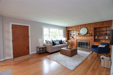 Living room featuring wood burning fireplace with