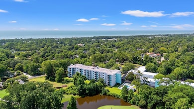 Bird's eye view of a large body of water and apartment complex